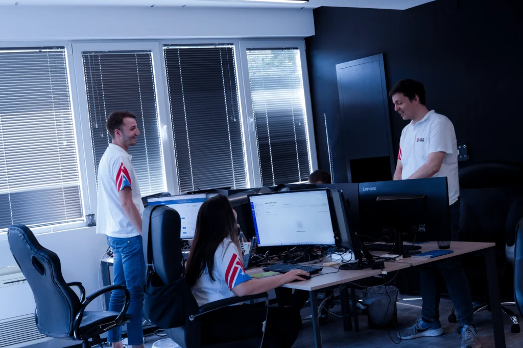Flatbed dispatchers collaborating in the House of Trucking office