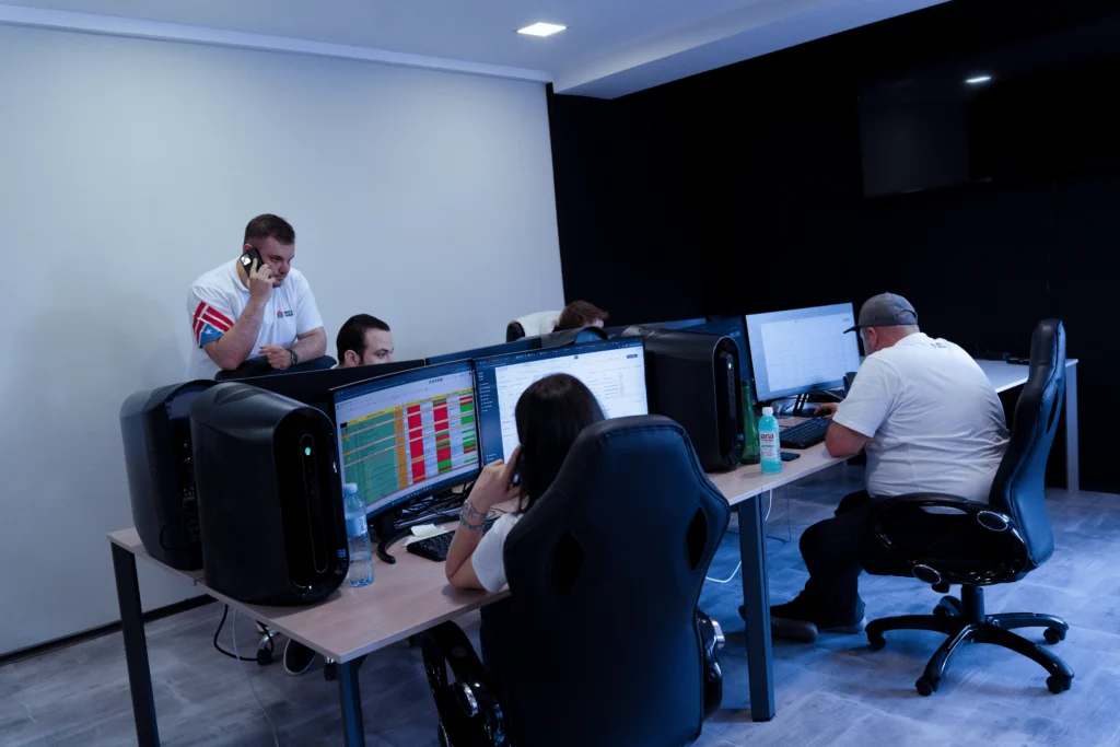 House of Trucking dispatch team working at multiple computer screens