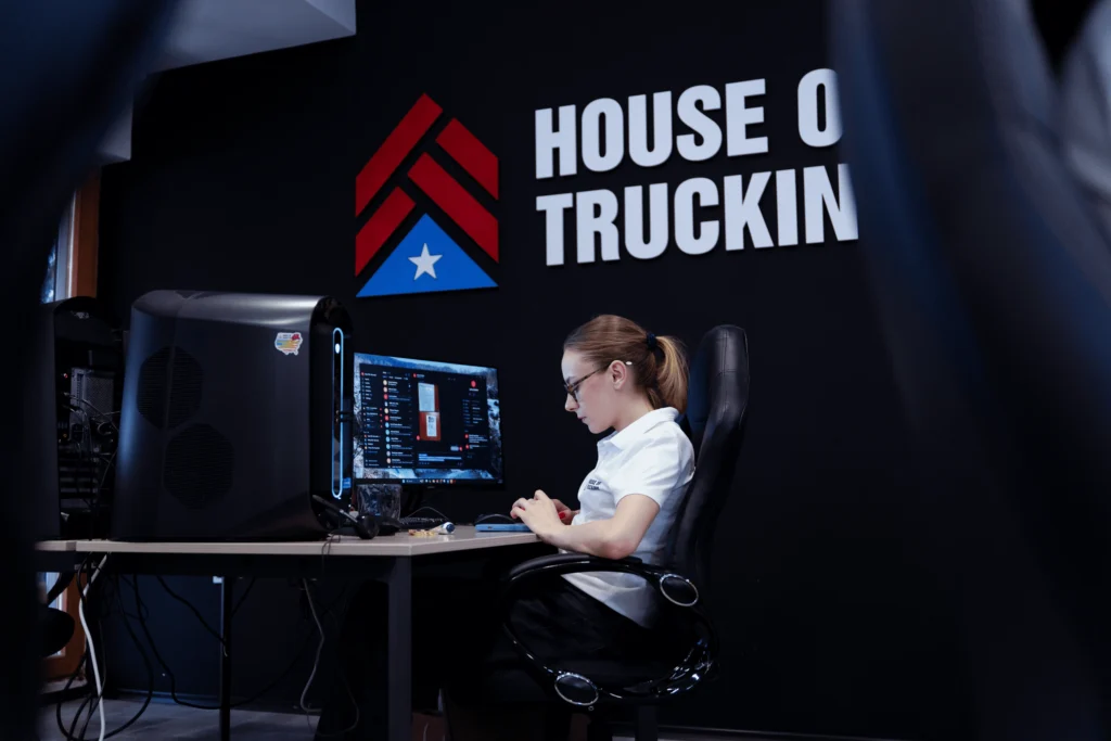House of Trucking recruiter working on driver applications at the office