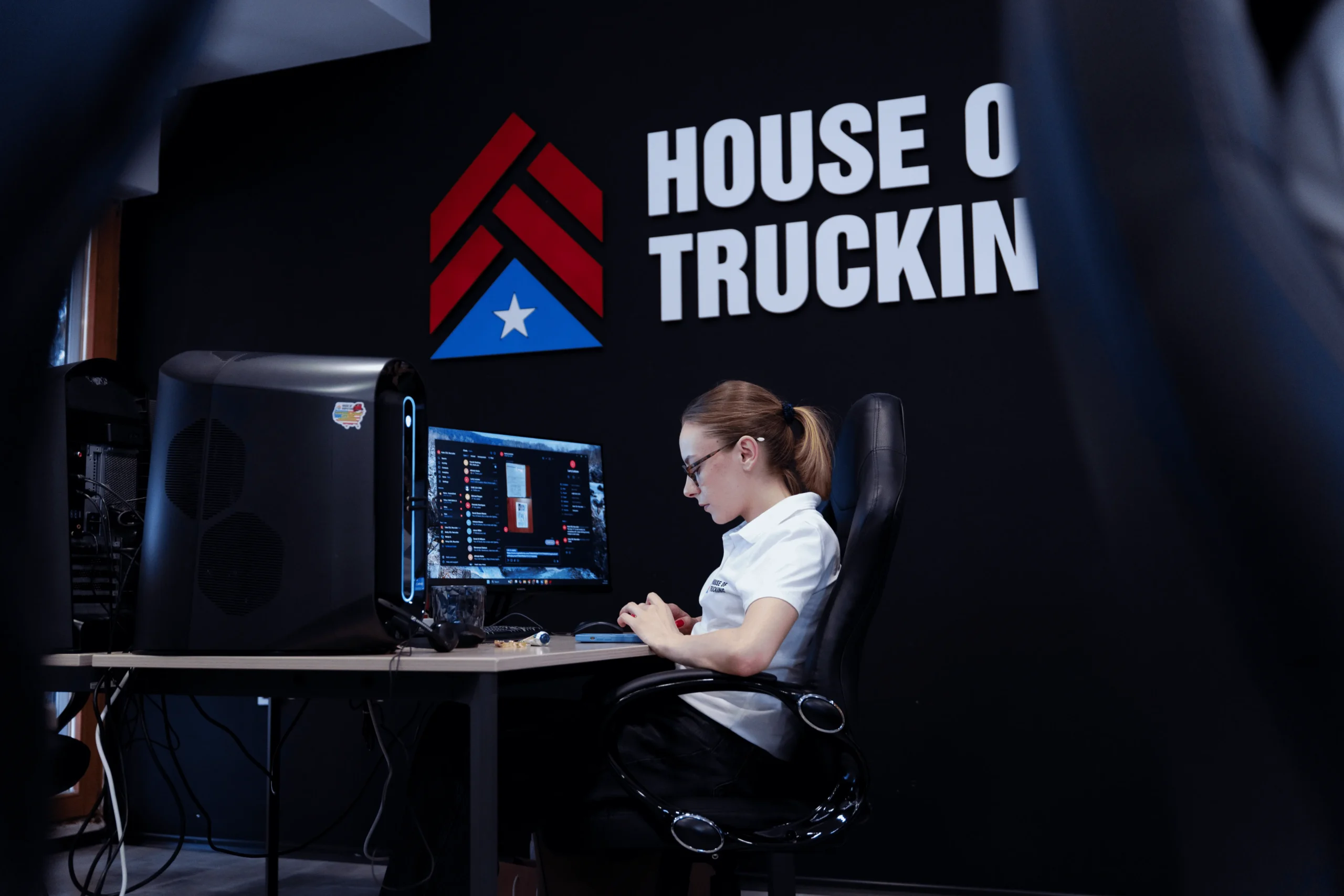 House of Trucking recruiter working on driver applications at the office