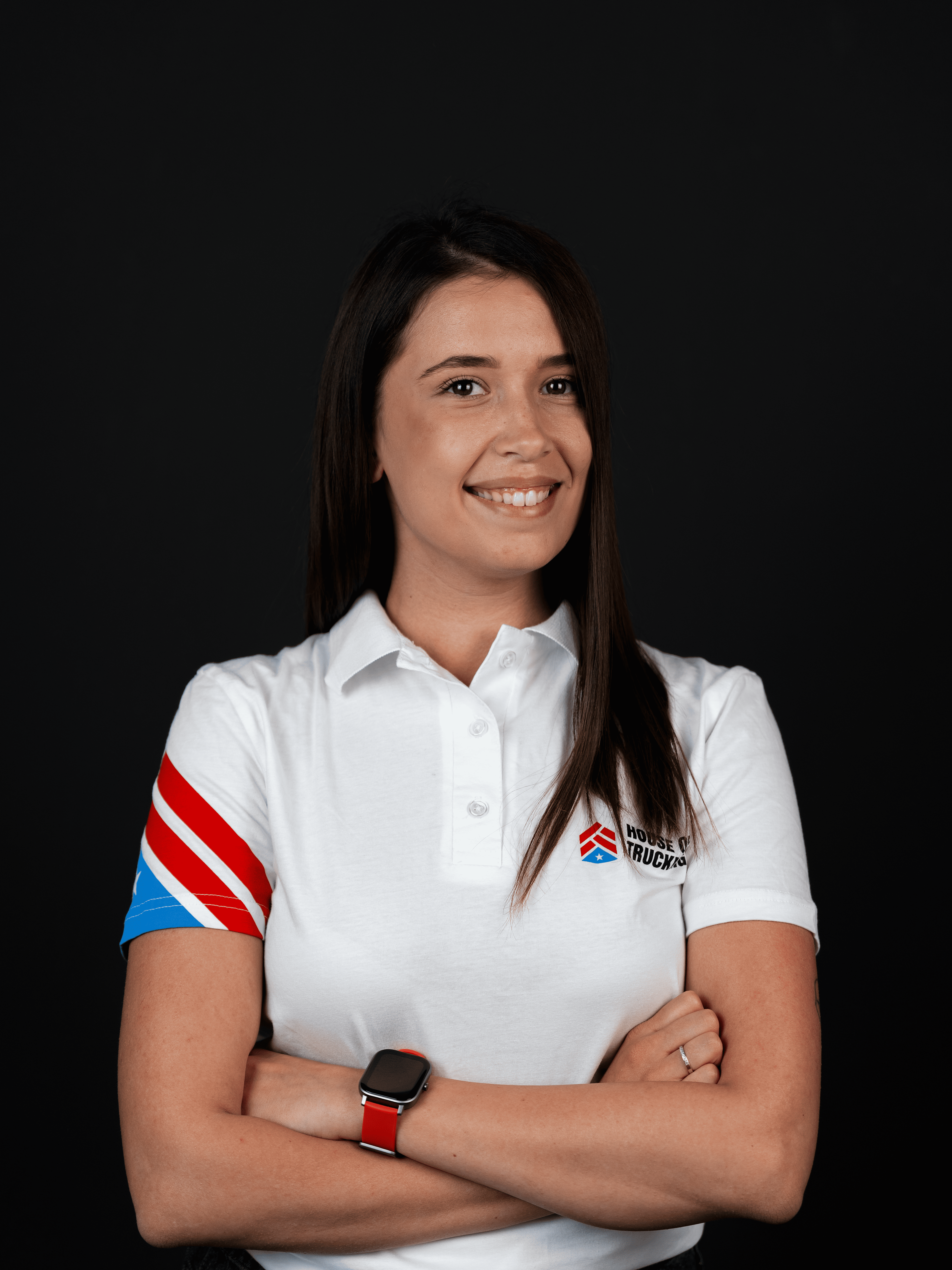 Maria, Master Driver Recruiter at House of Trucking, smiling confidently in company uniform.