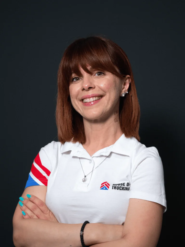 Tamara, Office Engine Manager at House of Trucking, smiling confidently in team uniform.