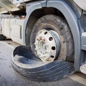 Blown truck tire on a semi-truck after an accident on the road